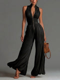 Svart V-ringad ärmlös dragkedja plisserad vidbenad chiffong jumpsuit